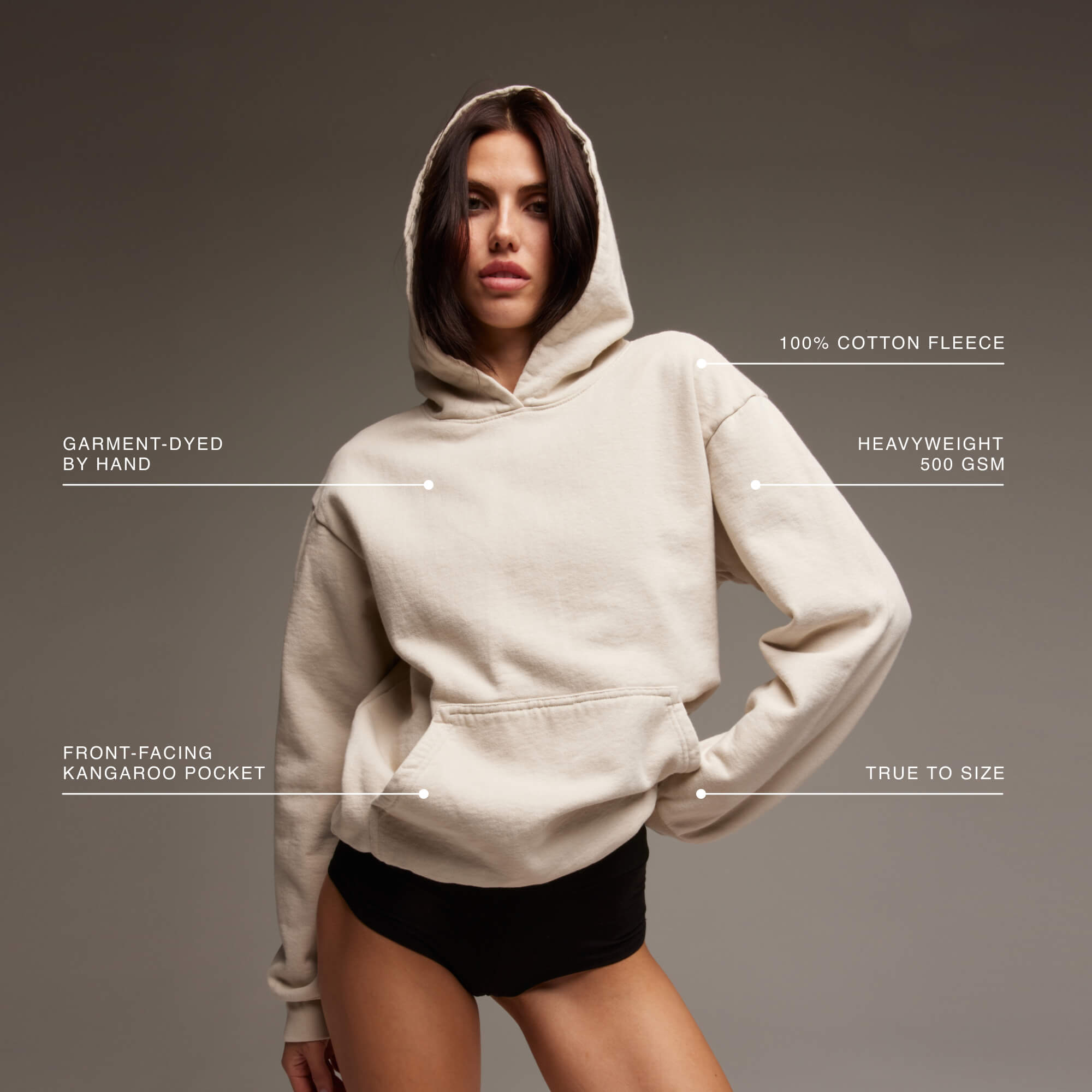 Model wearing the Womens Heavyweight Hoodie in the best selling color way 'Bone'.